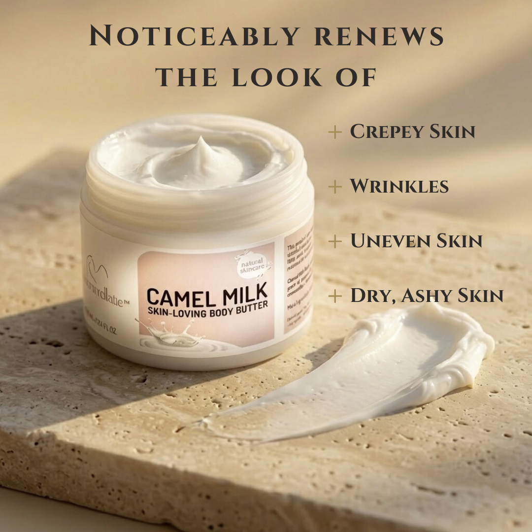 An open jar of Cammellatte Camel Milk Body Butter, with a rich creamy texture, sits on stone. Warm natural light highlights its nourishing formula, designed to renew crepey skin, wrinkles, uneven tone, and dryness.